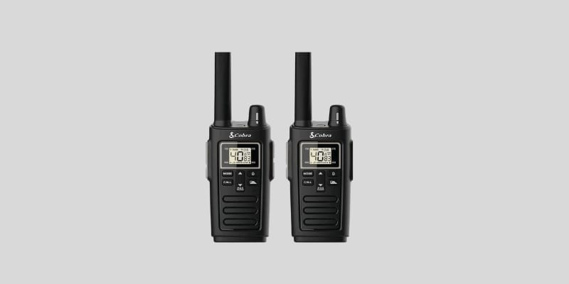 "Two black Cobra RX380 walkie talkies with orange accents, featuring digital displays, antennas, and multiple buttons, designed for long-range communication."