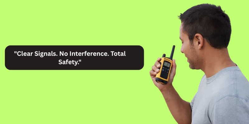 "A person holding a yellow walkie-talkie with the text 'Clear Signals. No Interference. Total Safety.' against a green background."